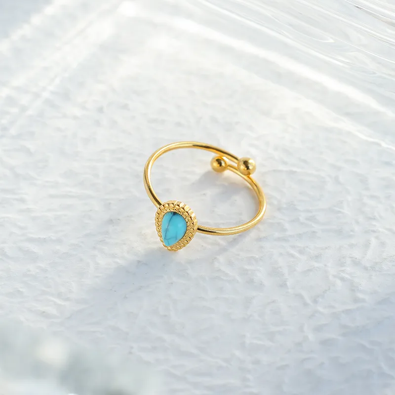 Bague Acier Inoxydable Dorée Pierre Turquoise Goutte Contour Perlé Ajustable